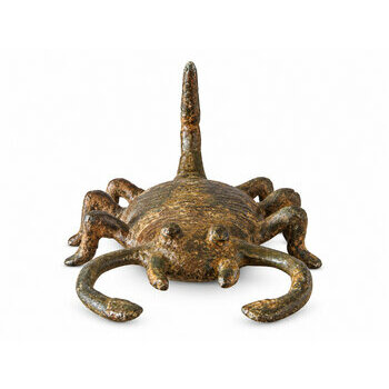 Front view of a bronze scorpion with open pincers