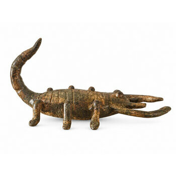 Handmade bronze scorpion shown in profile with raised tail